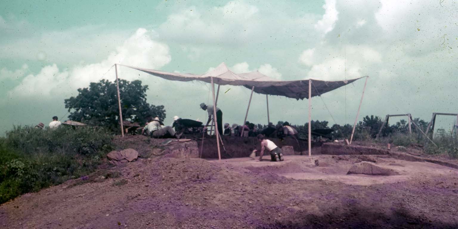 An image of the excavation of the Angel Mounds under a canopy to provide shade.
