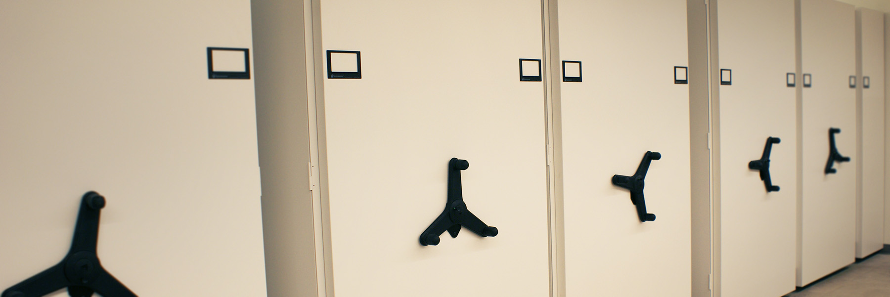 An image of a row of compact shelves.